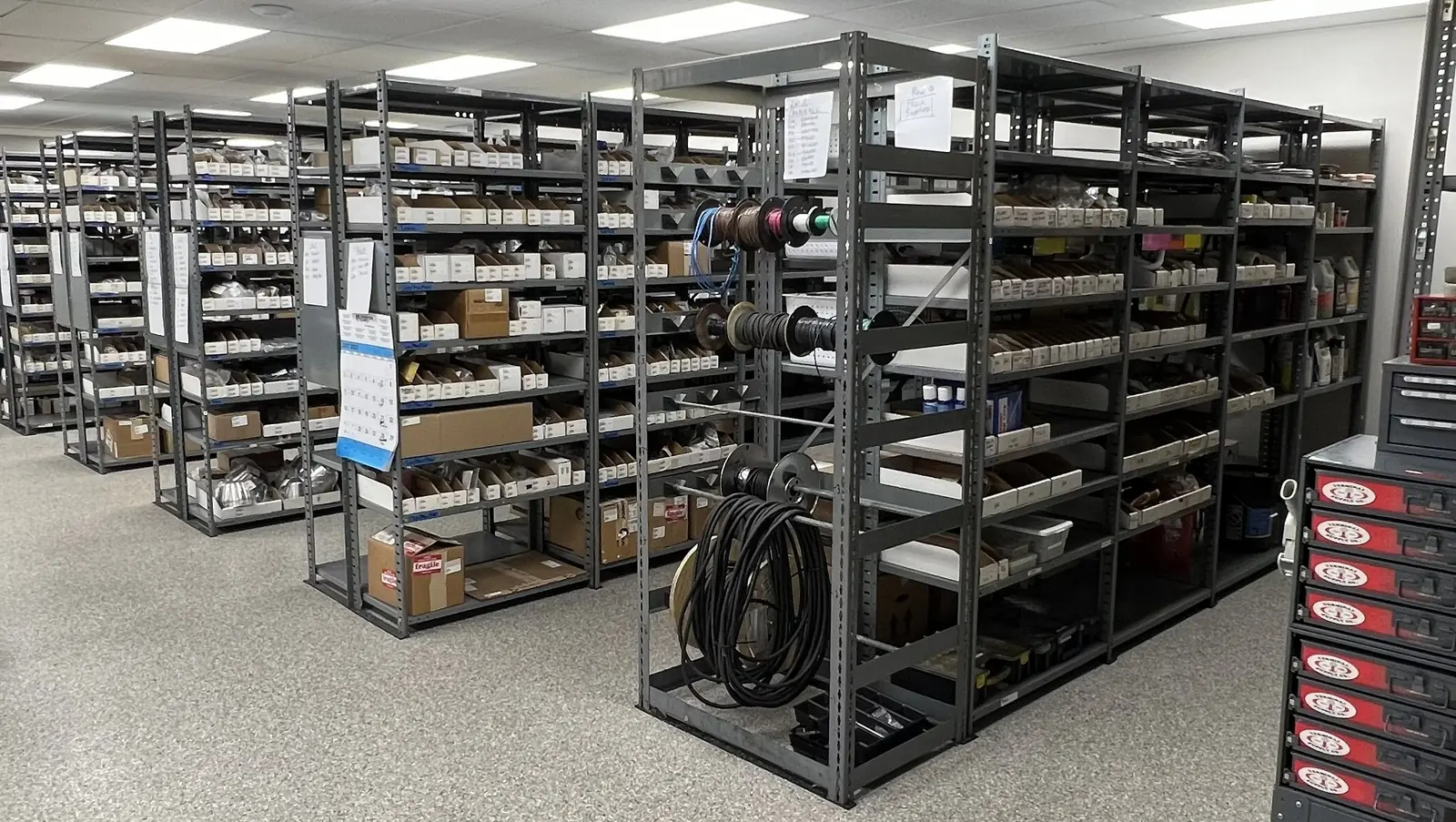 Rows of stocked parts shelving at the CONES Solutions Moline warehouse